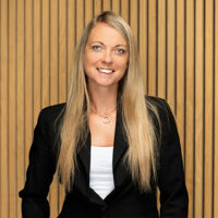 Headshot of woman in black suit